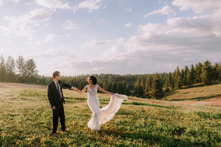 bride and groom in field