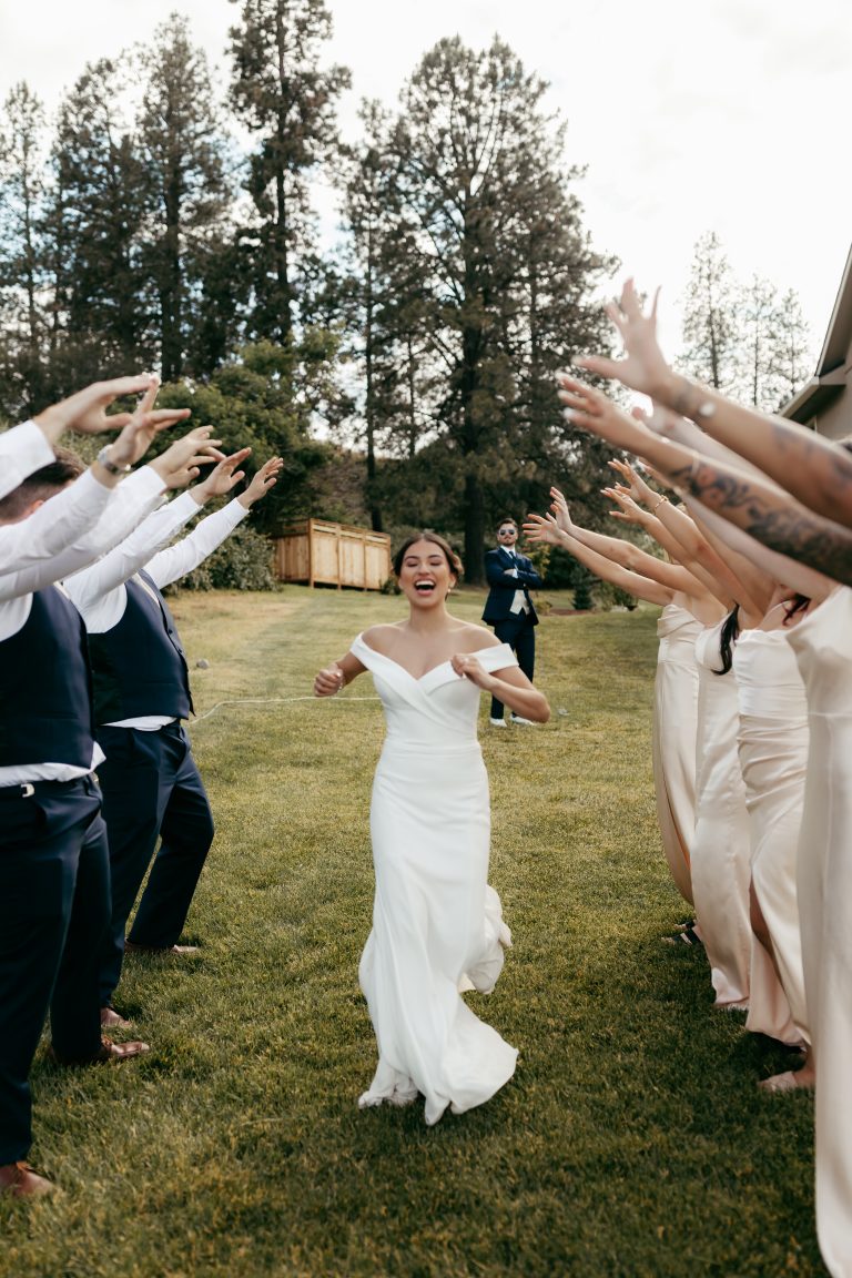 bride walking through crowd at wedding